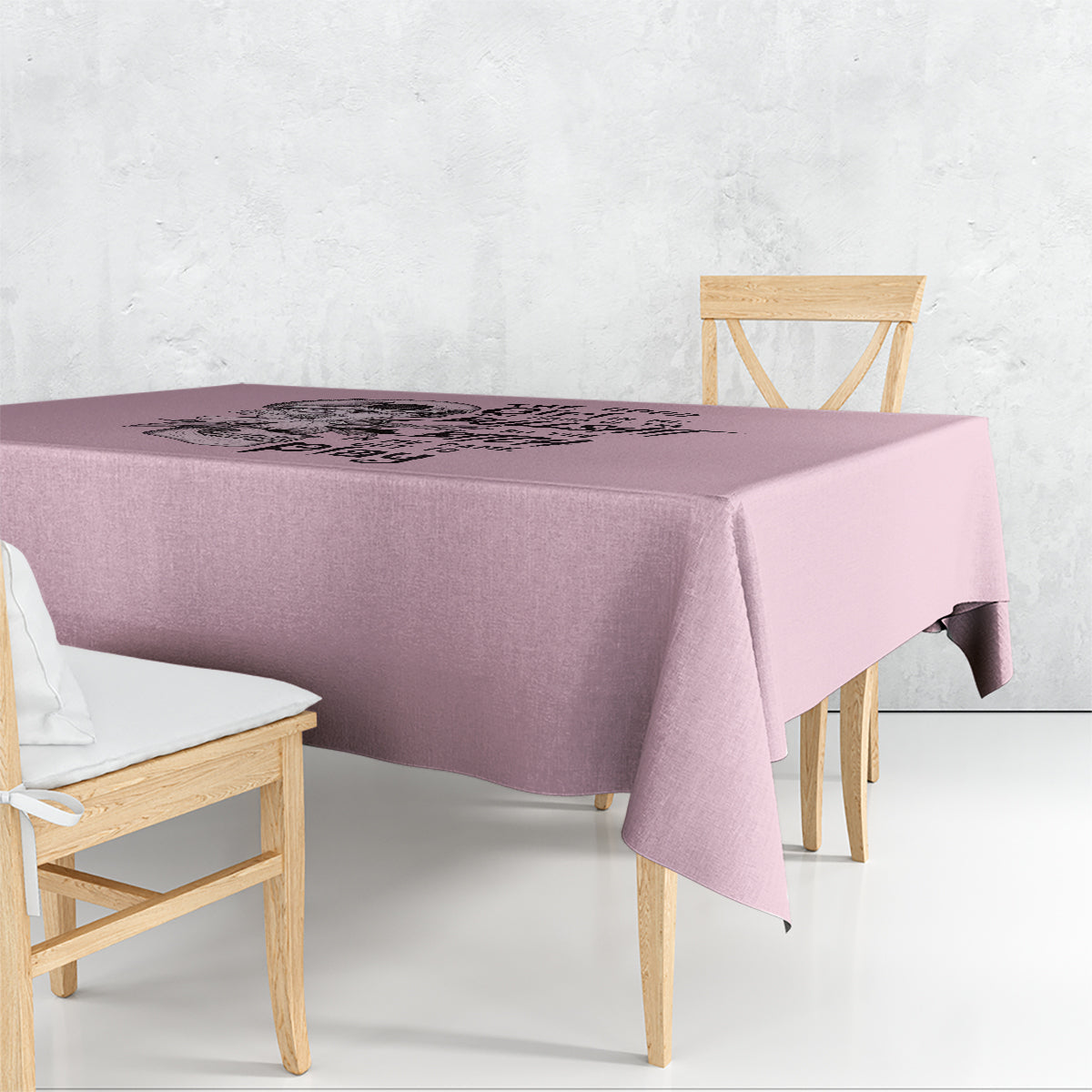 Mauve skull-themed tablecloth with centered graphic, draped over table corner