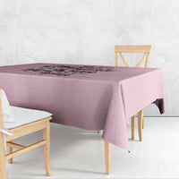 Mauve skull-themed tablecloth with centered graphic, draped over table corner