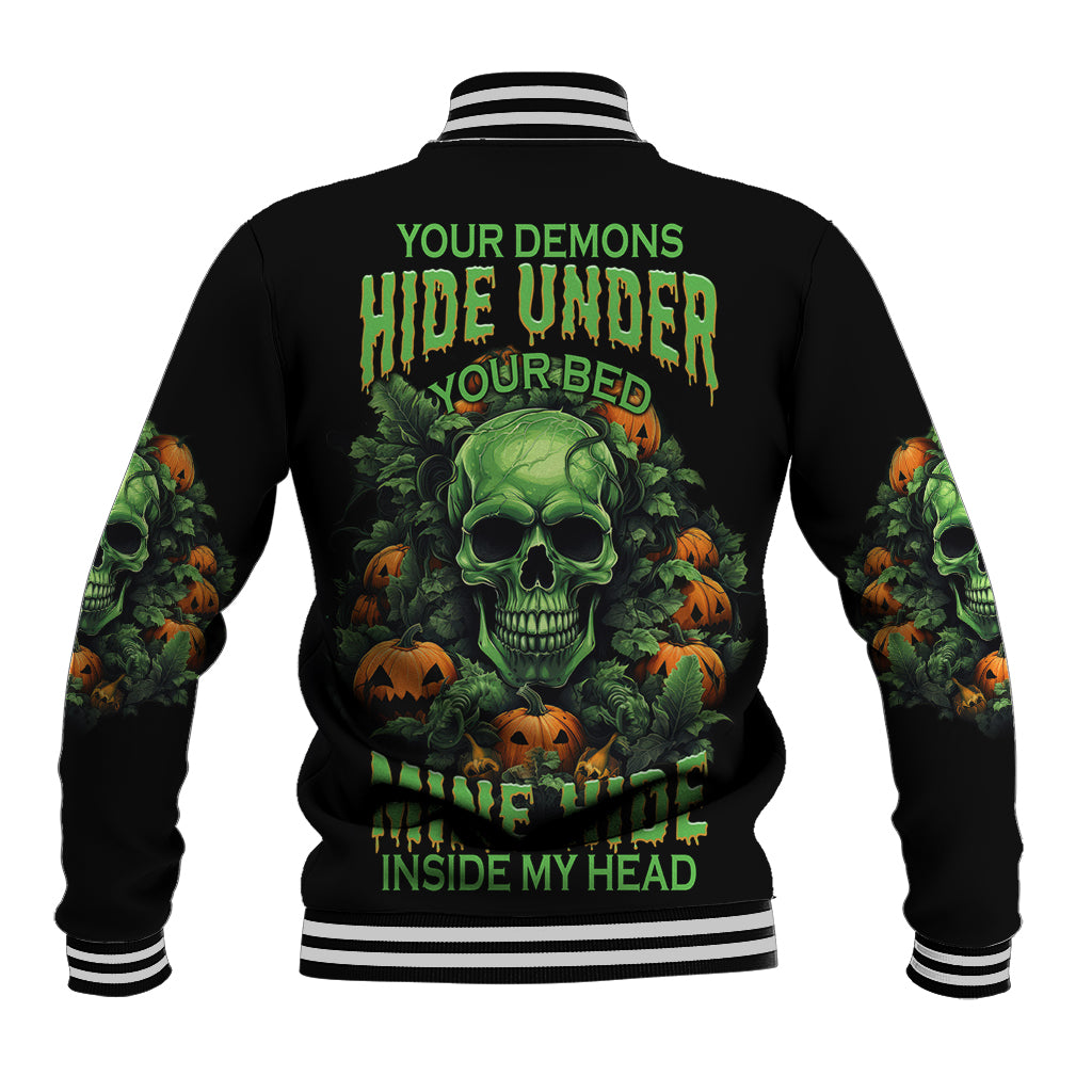 Black baseball jacket with green skull-and-pumpkin graphic on back, striped ribbed collar