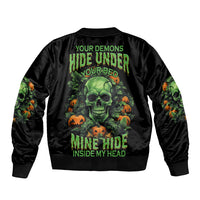 Black bomber jacket with green skull, pumpkins, and vine graphic on back
