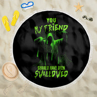 Round black Halloween beach blanket with green monster graphic and white fringed edge