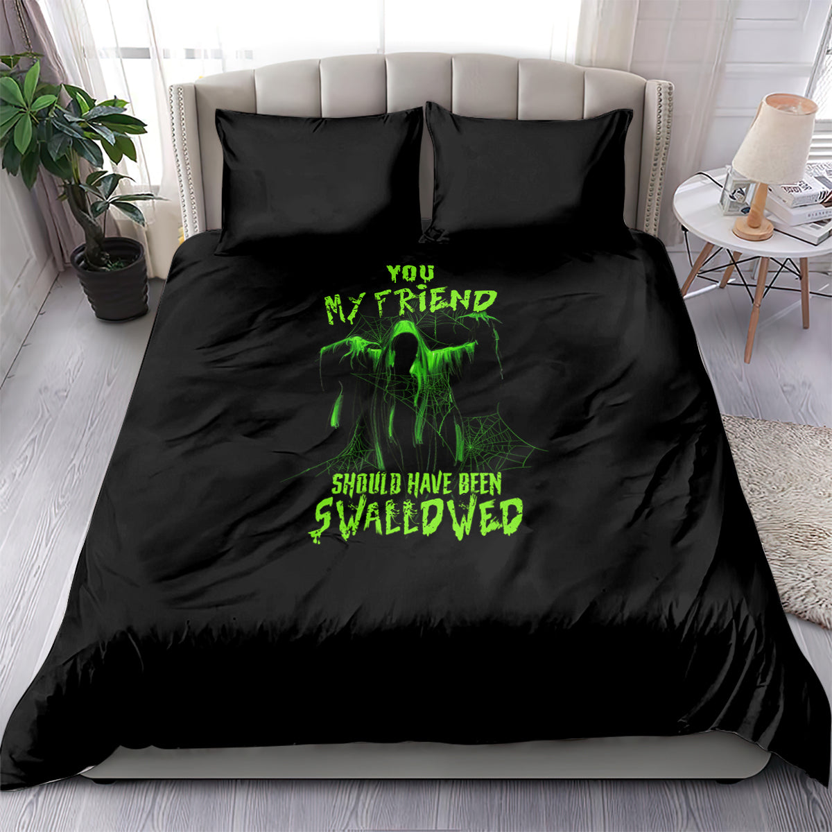 Black Halloween bedding set with green glowing monster graphic and text on duvet