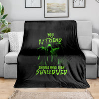 Black Halloween throw blanket with green skull graphic and text design
