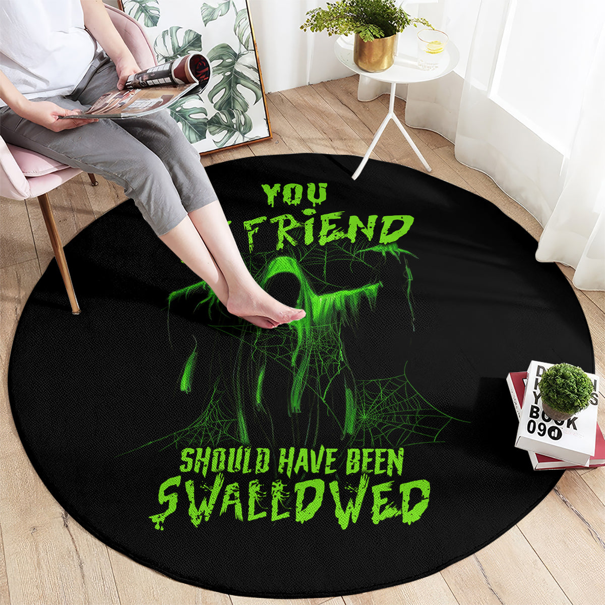 Black round Halloween rug with green alien skull and 'Should Have Been Swallowed' text