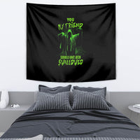 Halloween tapestry with black fabric and neon green graphic text, draped on wall
