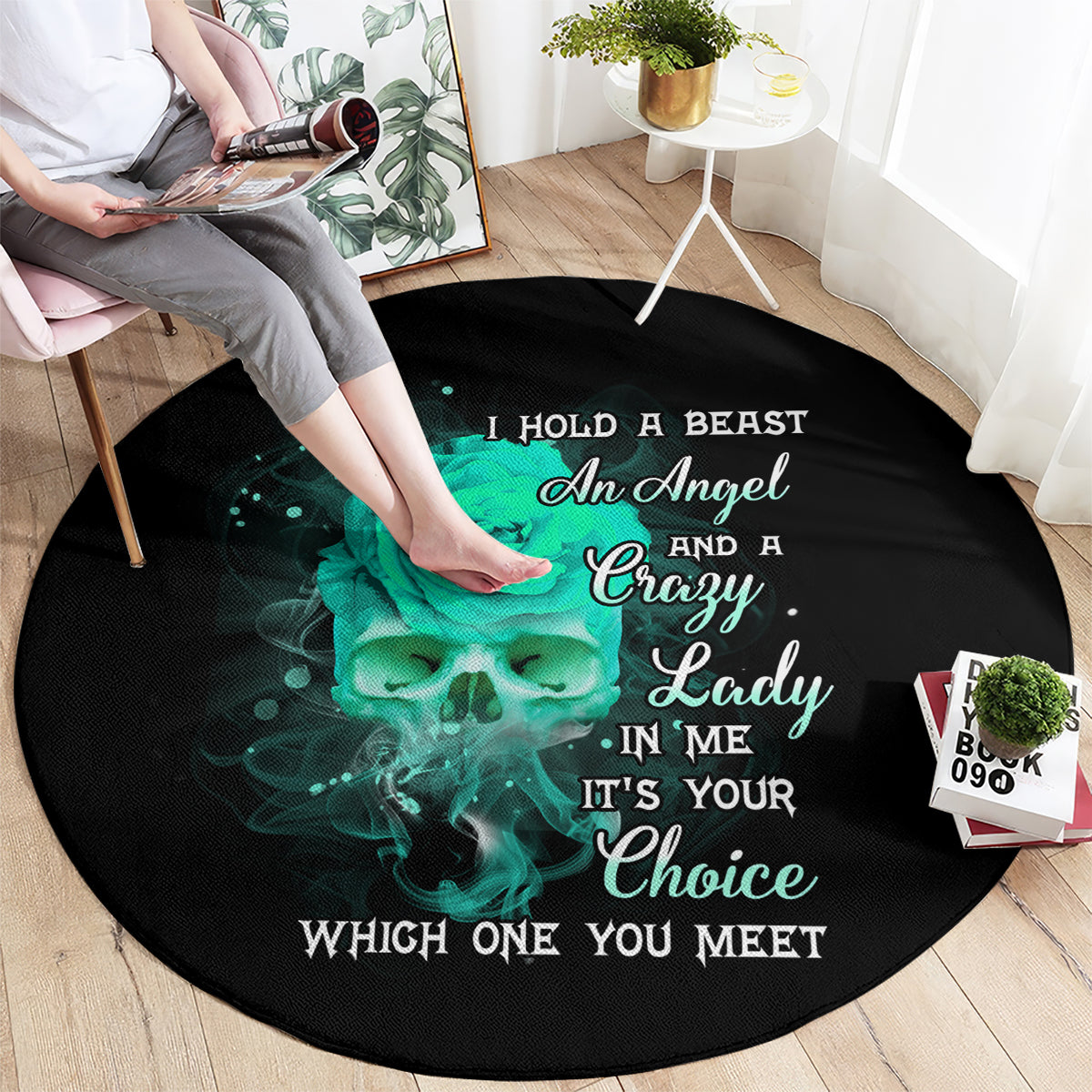 Round black rug with teal skull rose graphic and white slogan text