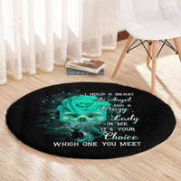 Round black rug with teal skull rose graphic and white slogan text