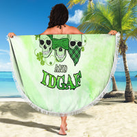 Round green beach blanket with skull faces and 'IDK IDC and IDGAF' text, fringed