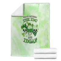 St. Patrick's Day green blanket laid flat, skull faces and shamrock text graphic centered
