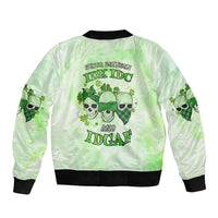Light green bomber jacket with black ribbed collar and back skull graphic in green