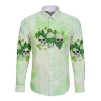 Front of green long-sleeve button shirt with skull and clover graphic, center text