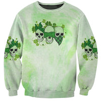 Light green crewneck sweatshirt with centered skull-and-clover graphic on front
