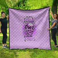 Purple quilt blanket with quilted diamond stitching and bold gothic floral text design