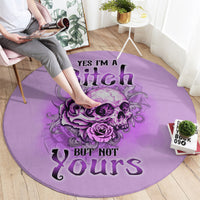 Purple round rug with skull and roses graphic and bold “YES I’M A BITCH” lettering
