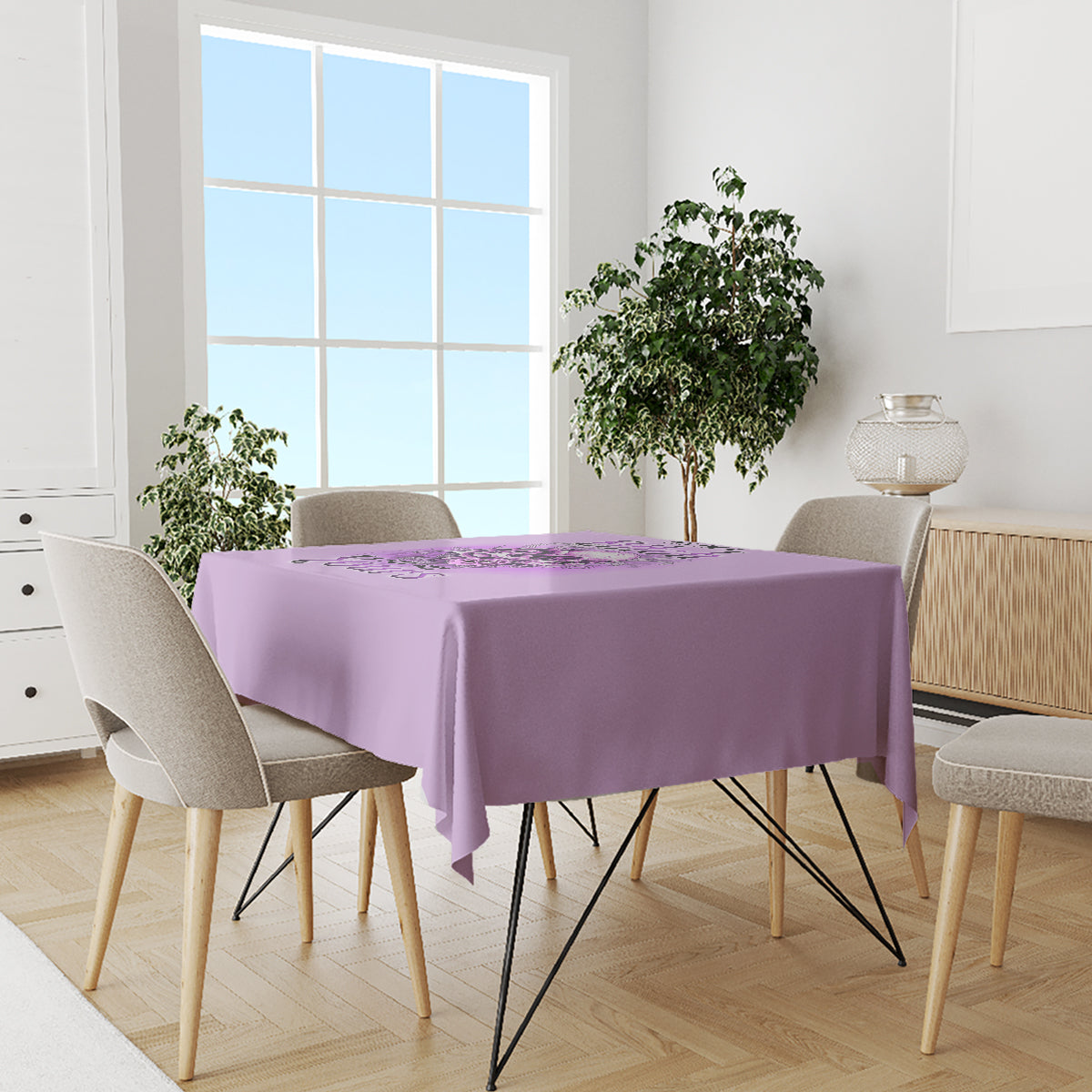 Purple printed tablecloth on dining table with chairs