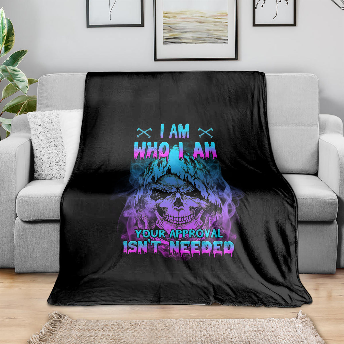 Black throw blanket with blue and purple skull graphic and 'I AM WHO I AM' text