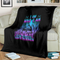Black blanket on sofa with blue and purple skull graphic and 'I AM WHO I AM' text