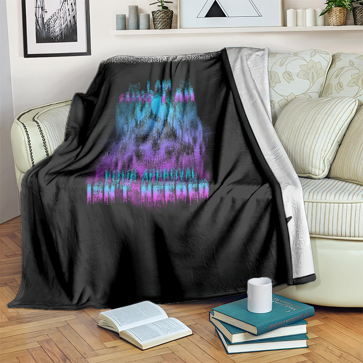 Black blanket on couch with blue and purple dripping skull graphic