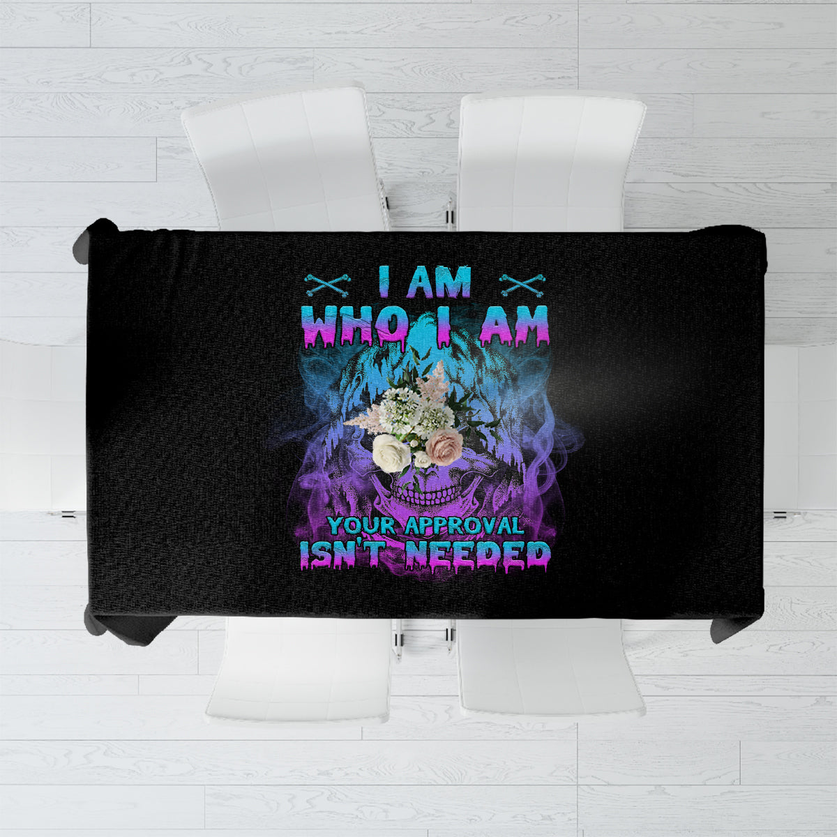 Black tablecloth folded flat with multicolor text graphic: I AM WHO I AM