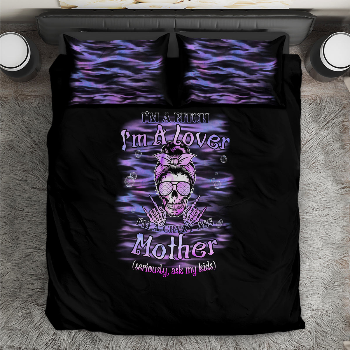 Black duvet set with purple skull-and-text graphic and two square matching pillowcases