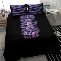 Black bedding set with purple skull-and-text center print and two matching pillowcases