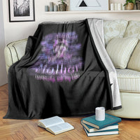 Black throw blanket with blurred purple skull graphic and 'Mother' quote