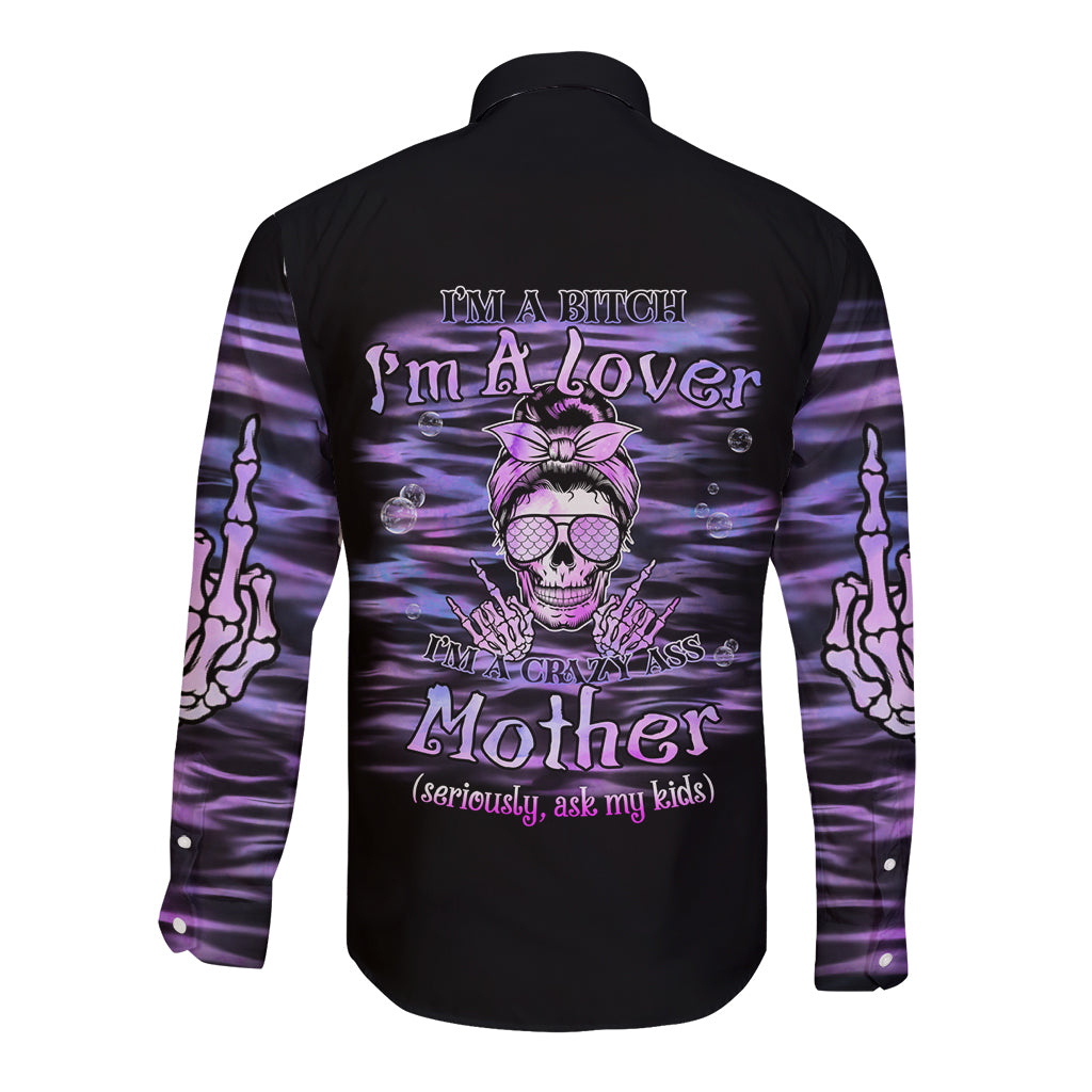 Black long-sleeve button shirt with purple graphic skull and text on back