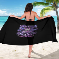 Black printed sarong with purple skull mother graphic, held wide
