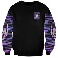 Unisex black sweatshirt with small purple skull chest logo and purple hand print sleeves