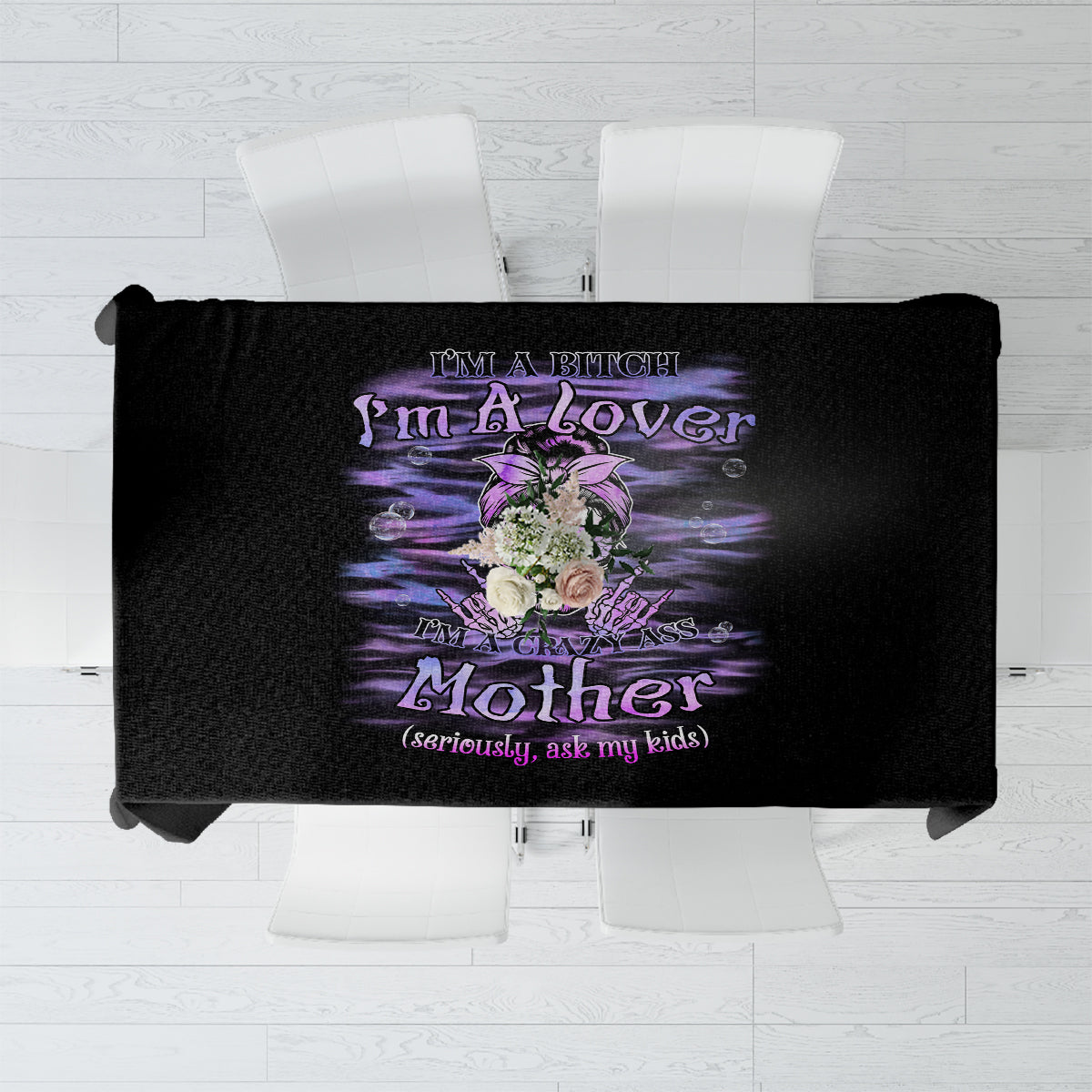 Black tablecloth with centered purple message graphic and floral details