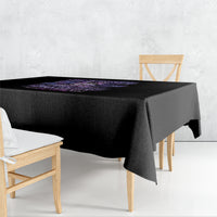 Black square tablecloth with purple graphic print and draped corner