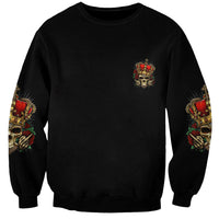 Black crewneck sweatshirt with small skull emblem, plus sleeve rose-skeleton prints
