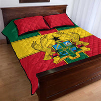 Quilt bed set with diagonal Ghana flag colors and coat of arms print; two red pillows