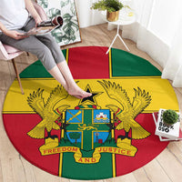 Round Ghana coat of arms rug in multicolor, hand smoothing edges on floor