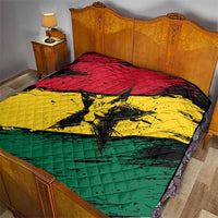 Ghana flag quilt with coat of arms star, spread across a bed in red yellow green
