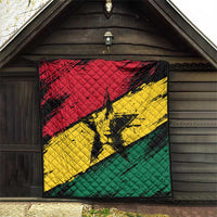 Ghana flag quilt with coat of arms star, displayed in a wooden barn doorway