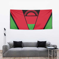 Malawi flag tapestry above couch, red-green flag with central black emblem