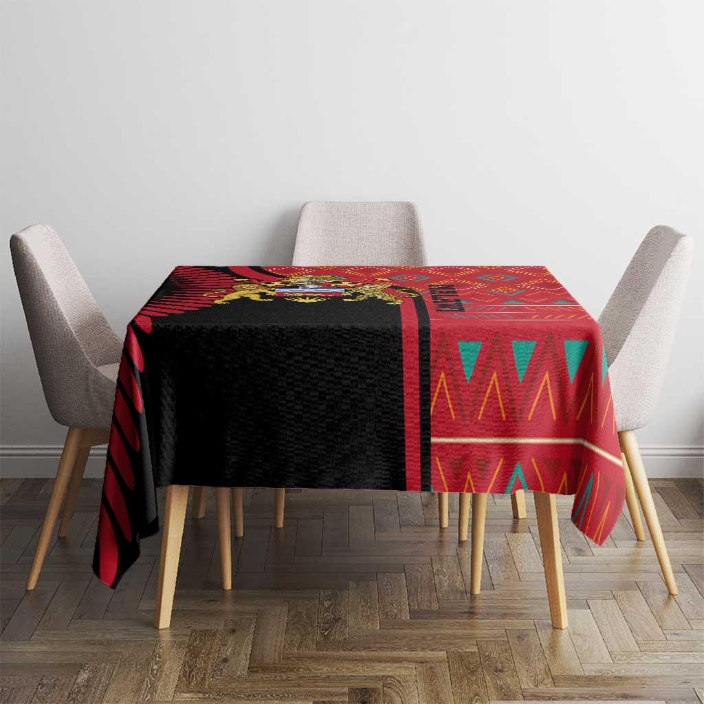 Rectangular tablecloth with red-and-black patterned center panel over table
