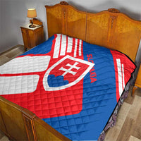 Slovakia flag quilt on bedspread, red and blue with white diagonal stripes and crest emblem