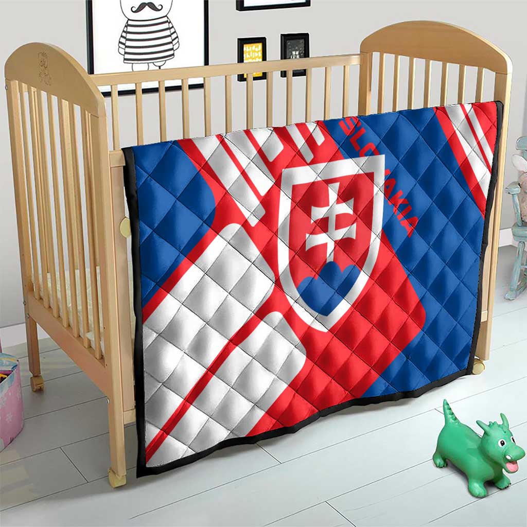Slovakia flag quilt on baby bed, red, white, and blue diagonals with center shield crest
