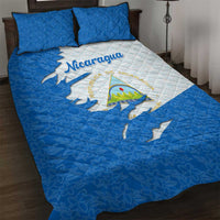 Quilt bed set with Nicaragua flag design, quilted blue and white, includes two pillows