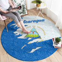 Round carpet with Nicaragua flag ripped map look, national emblem, and floral pattern