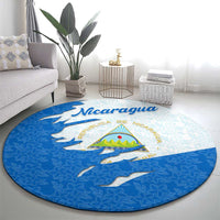 Round carpet featuring Nicaragua wordmark, national emblem, blue and light background