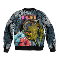 Dark cyan gradient bomber jacket, back shows HAWAII text with turtle and floral prints