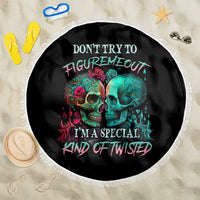 Round black beach blanket with multicolor twin skull design and white fringe trim