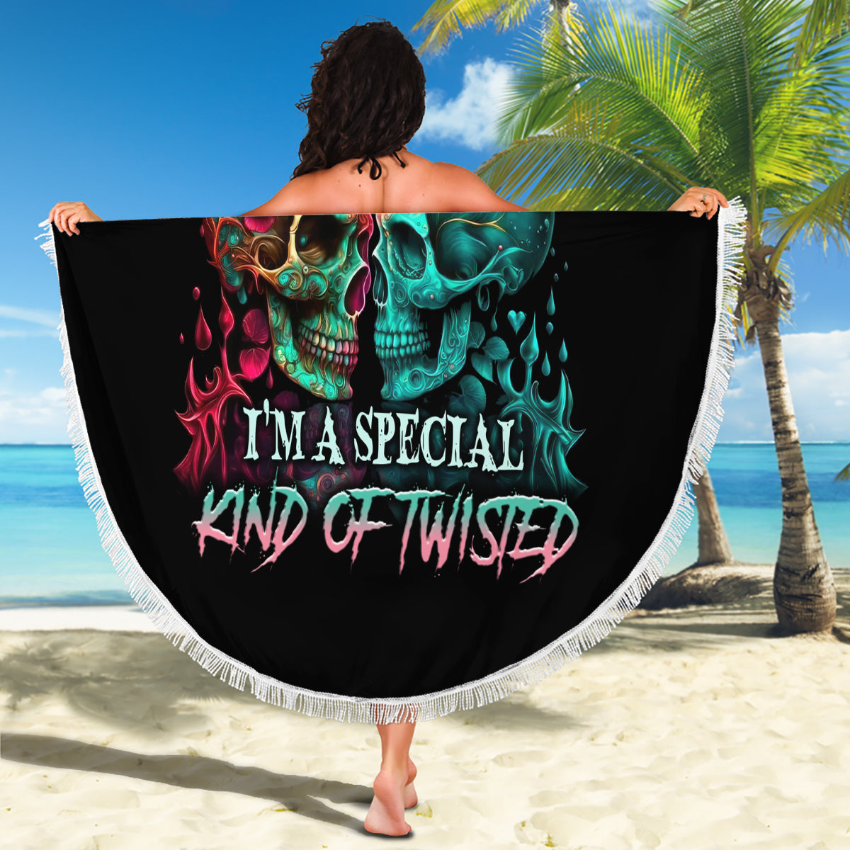 Round black beach blanket with multicolor skull print and white fringe trim