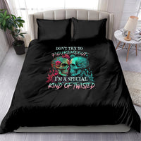 Black bedding set with twin skull graphic and slogan on duvet, with matching pillows