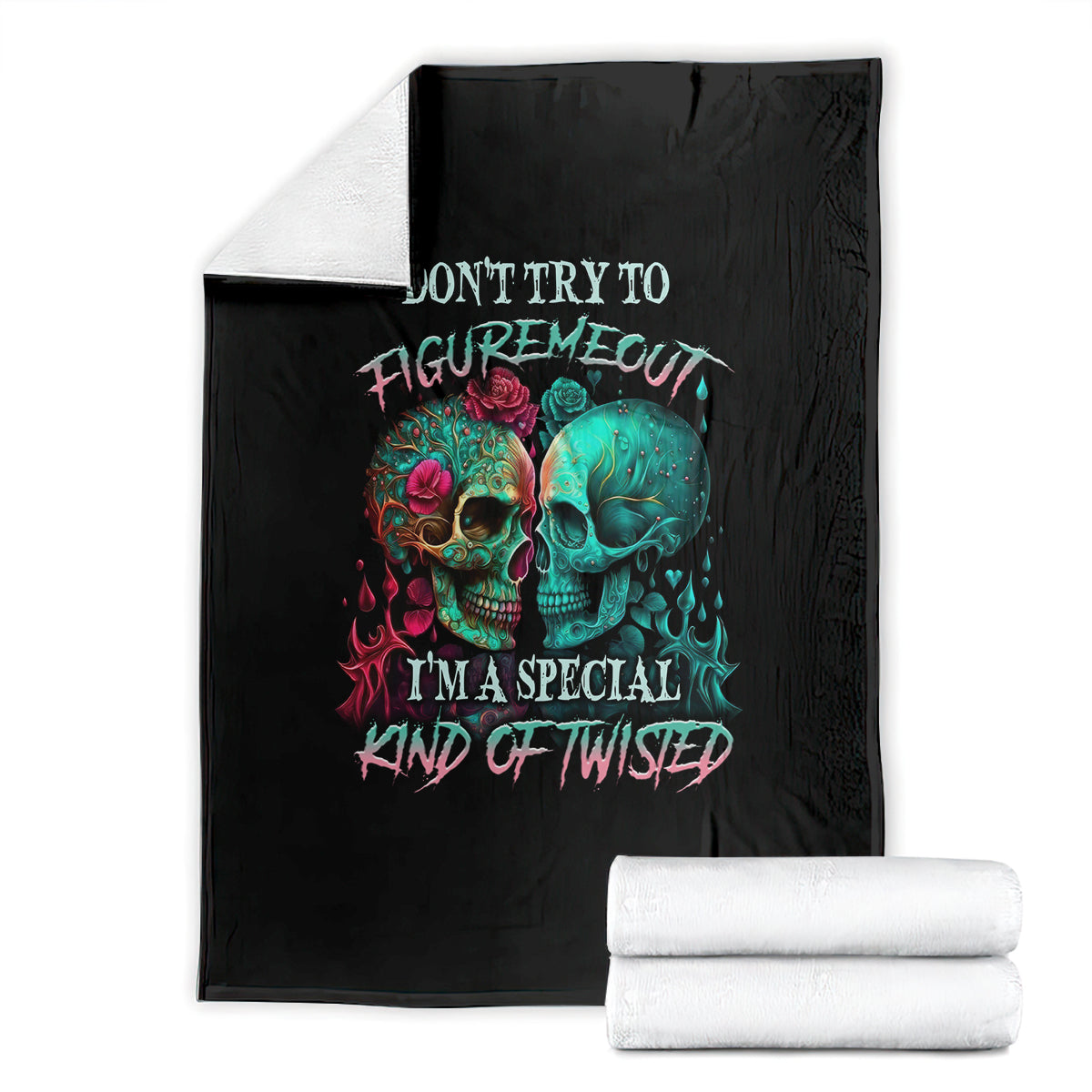 Black skull graphic blanket folded, multicolor twin skull faces and rainbow text