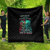 Black quilt with quilted diamond pattern and colorful twin skull graphic