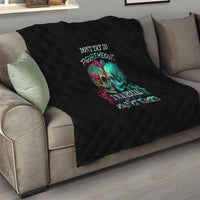 Black quilted throw with colorful twin skull graphic on couch